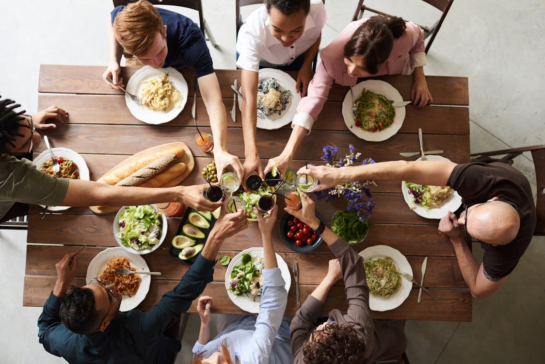 Friends enjoying food together at a table